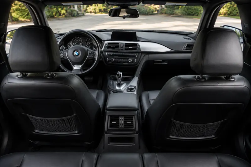 The same interior after detailing: clean seats, dash and floor